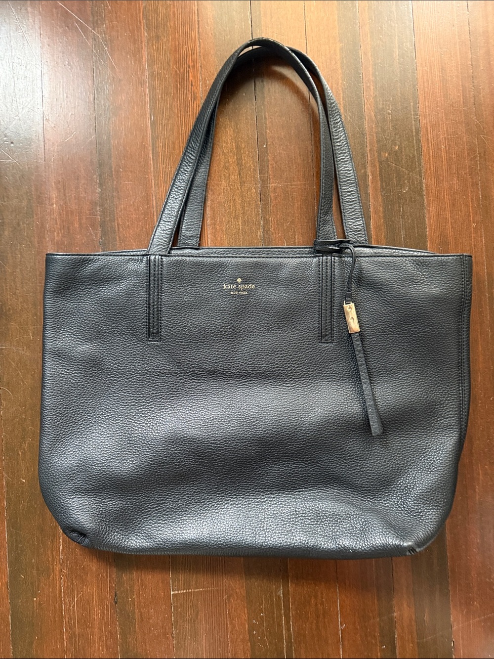 kate spade black pebbled leather tote with gold charm
